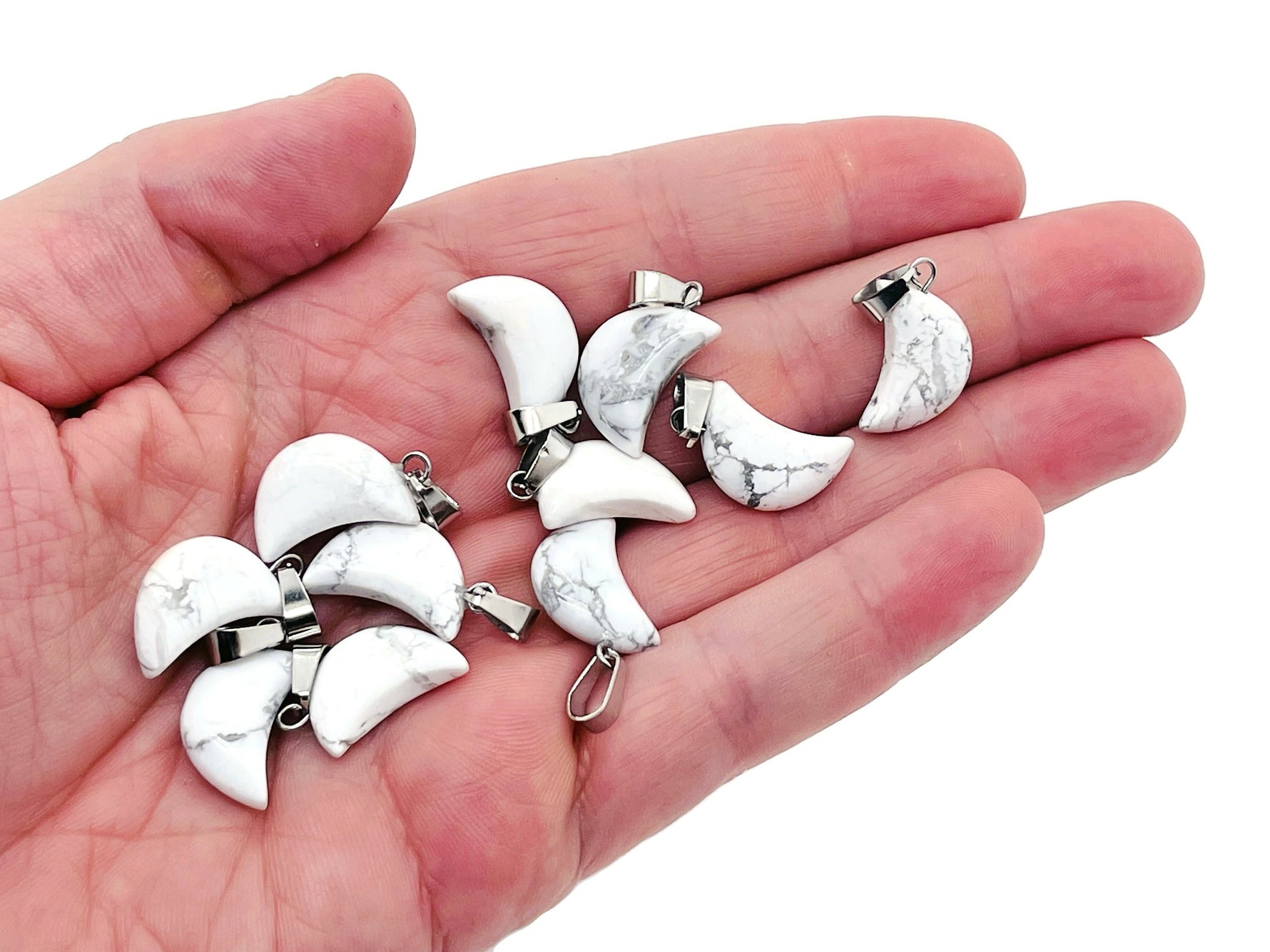 Howlite moon crystal pendant by GemstoneGO, featuring a polished white Howlite stone shaped as a moon, ideal for jewelry making.