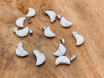 Howlite moon crystal pendant from GemstoneGO, showcasing a polished white gemstone with moon shape for jewelry making.