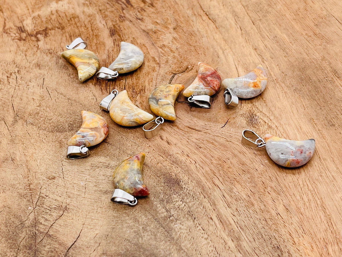 Crazy Lace Agate moon crystal pendant from GemstoneGO, featuring vibrant banded agate in a moon shape for jewelry making.