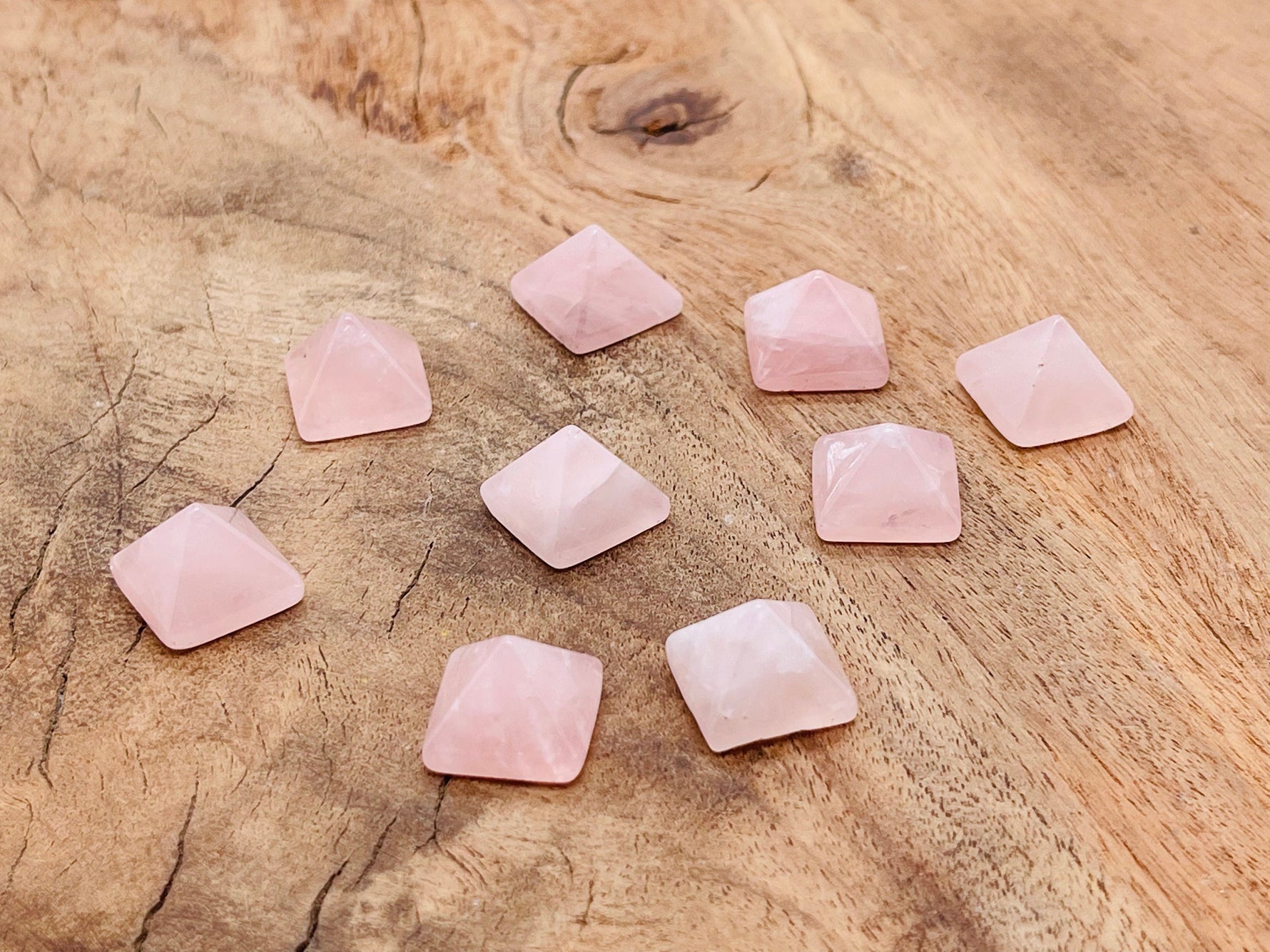 Pink rose quartz pyramid gemstone carving, 14mm size, from GemstoneGO, showcasing smooth polished surface and natural gemstone details.