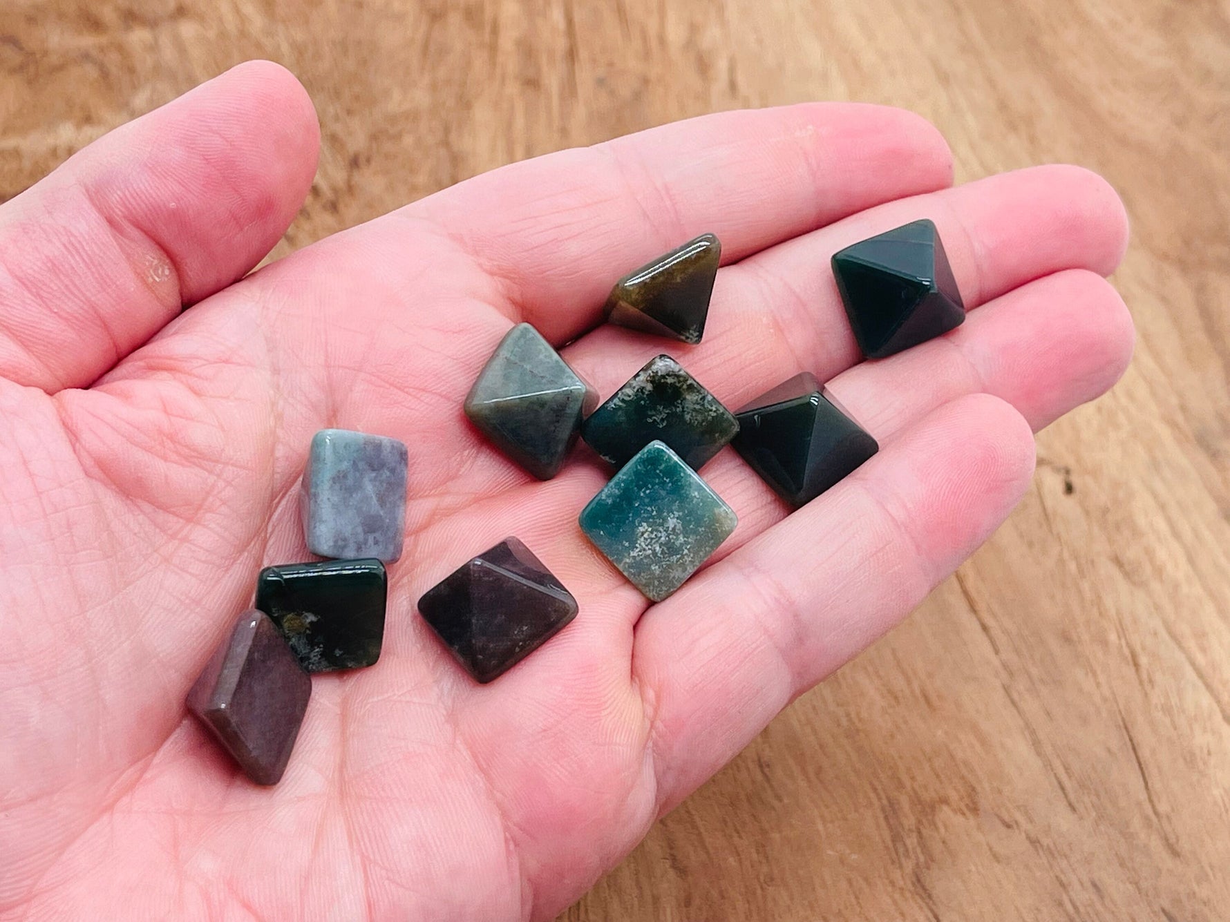 14mm moss agate pyramid carving gemstone from GemstoneGO, showcasing natural green and brown mineral patterns and a smooth polished surface.