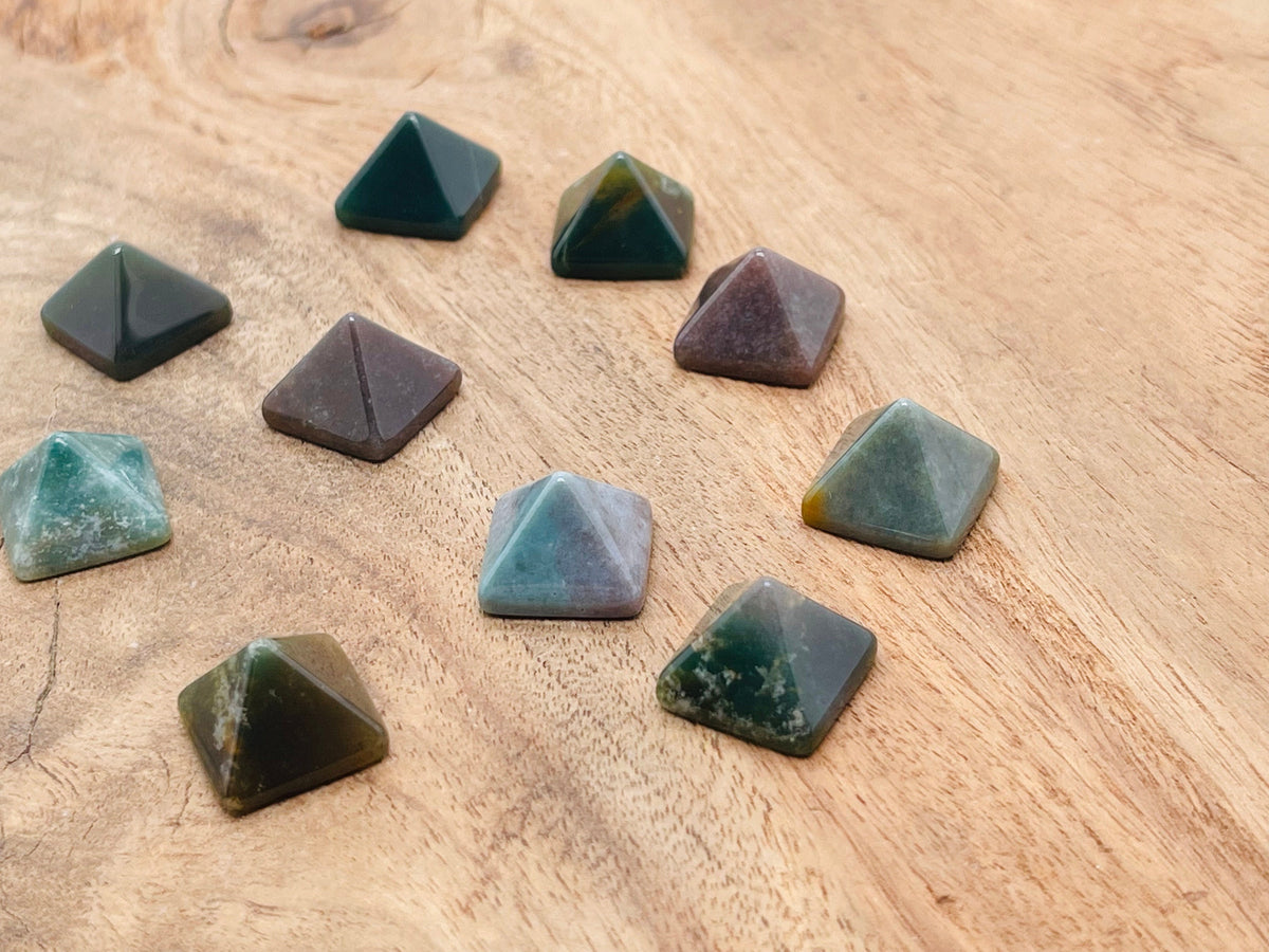 14mm Moss Agate pyramid gemstone carving from GemstoneGO, showcasing natural green and brown bands in a polished pyramid shape.
