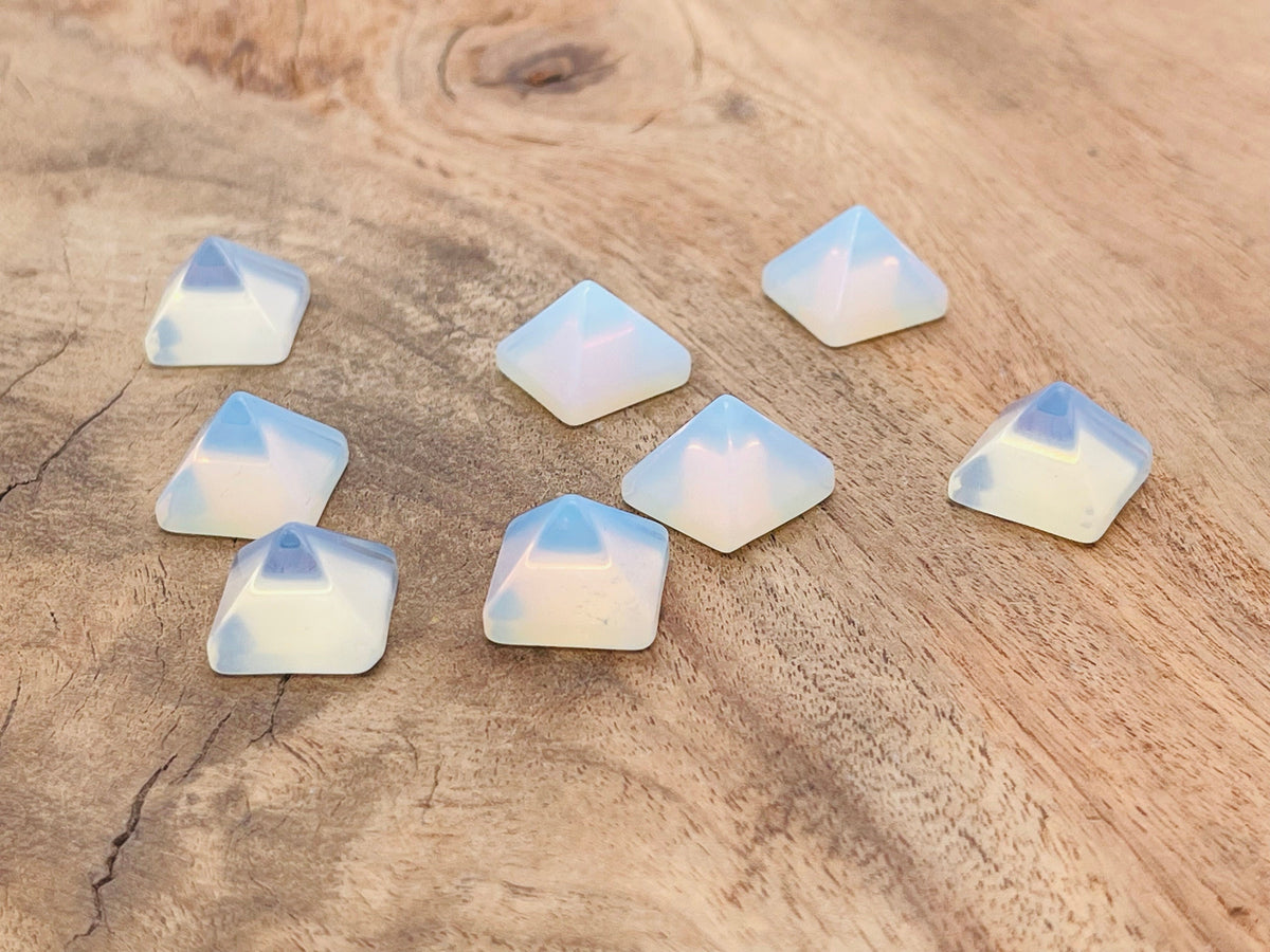 Opalite pyramid gemstone carving, 14mm size, from GemstoneGO, showcasing a smooth, polished translucent blue and white gemstone sculpture.