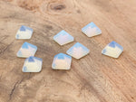 Opalite pyramid gemstone carving, 14mm size, from GemstoneGO, showcasing a smooth, polished translucent blue and white gemstone sculpture.