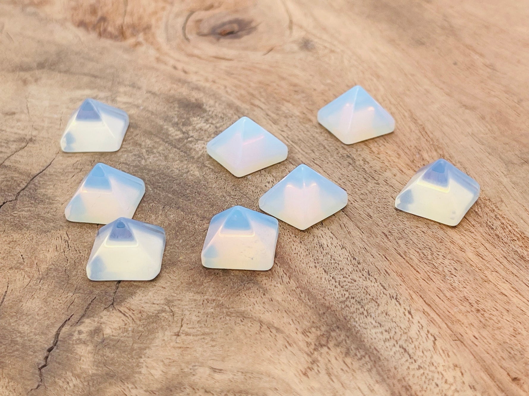 Opalite pyramid gemstone carving, 14mm size, from GemstoneGO, showcasing a smooth, polished translucent blue and white gemstone sculpture.