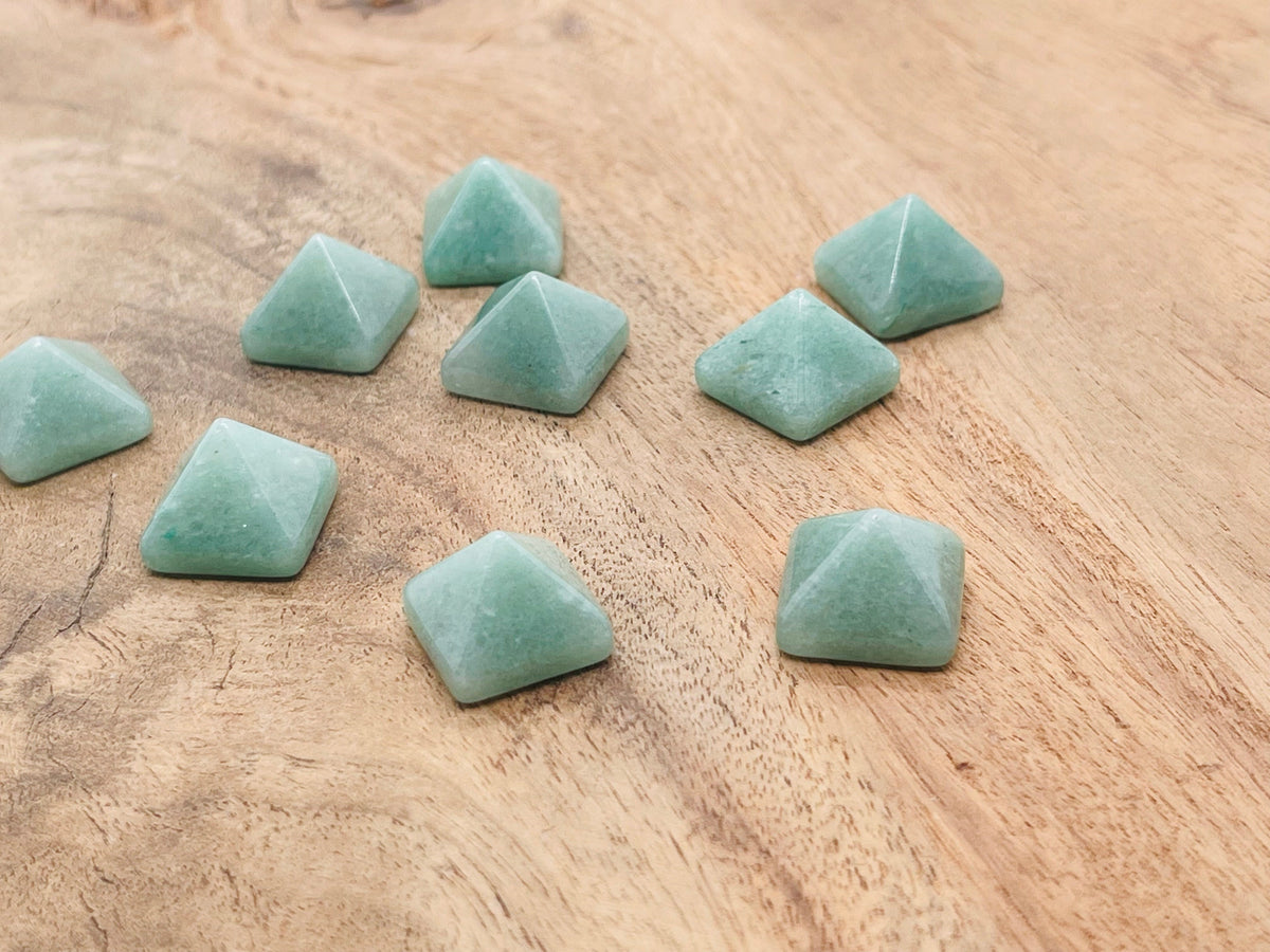 A 14mm Aventurine pyramid gemstone carving by GemstoneGO, showcasing smooth green stone with natural patterns and facets.