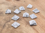 14mm Howlite pyramid gemstone carving by GemstoneGO, featuring a smooth white stone with gray veining and a pointed pyramid shape.