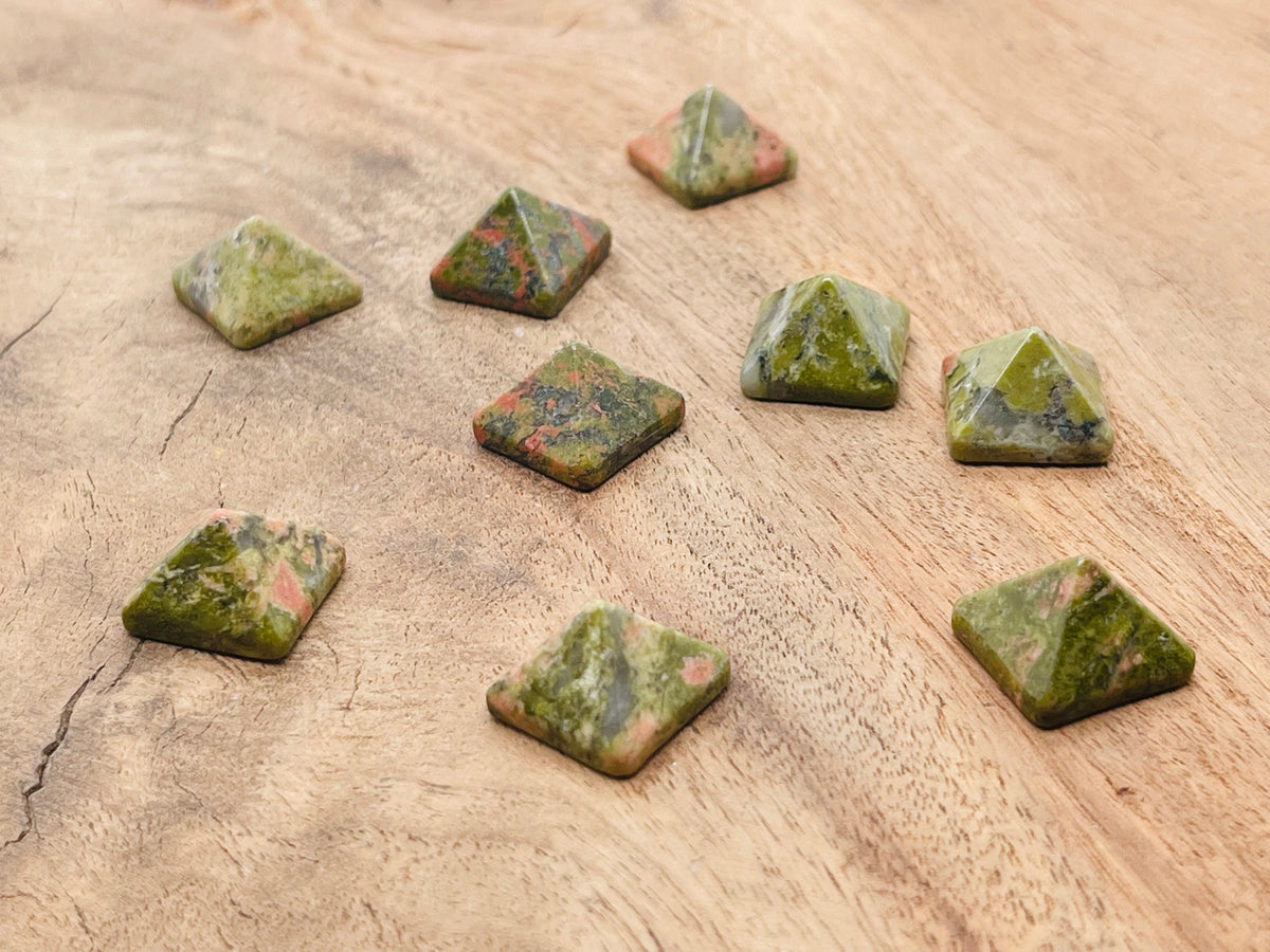 Unakite pyramid carving gemstone, 14mm, from GemstoneGO, featuring natural green and pinkish hues with smooth faceted surface.