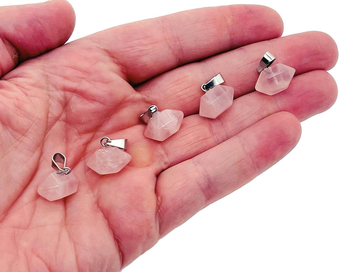 Rose Quartz crystal point pendant from GemstoneGO, featuring a polished pink stone suitable for jewelry making and accessories.