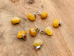 Yellow jade point crystal pendant by GemstoneGO, a polished gemstone jewelry making supply with a vibrant yellow hue.