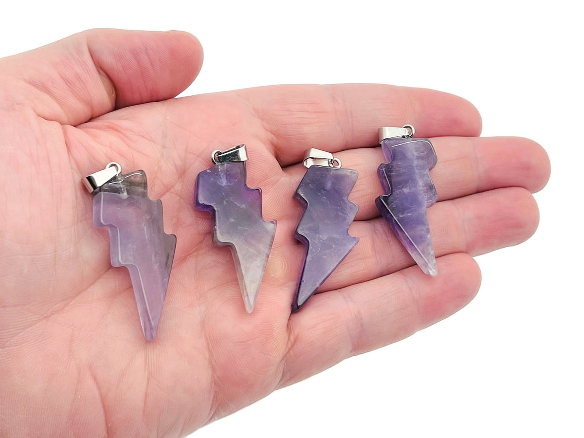 Amethyst Lightning Crystal Pendant by GemstoneGO featuring a striking lightning-shaped amethyst crystal pendant on a silver chain