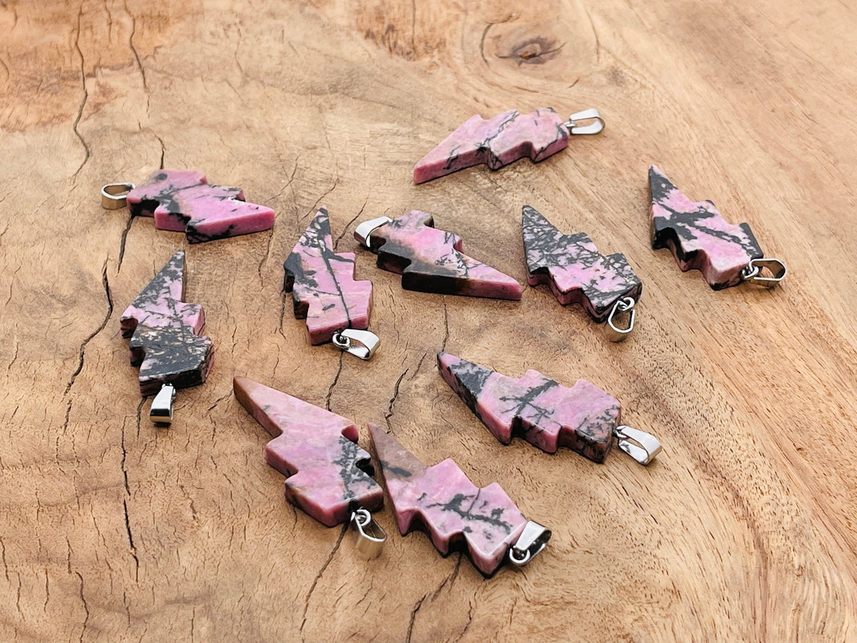 Rhodonite Lightning Crystal Pendant from GemstoneGO featuring a vibrant lightning stone gemstone on a silver chain.