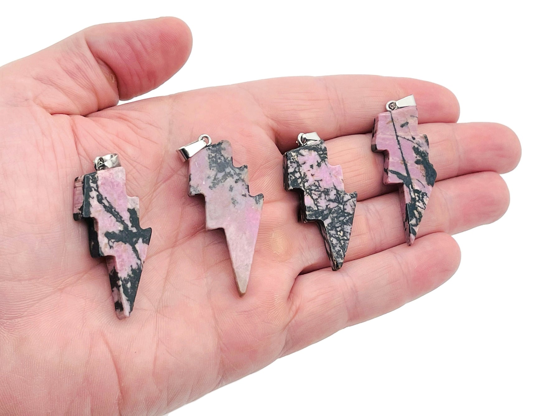 Rhodonite Lightning Crystal pendant featuring a striking lightning stone gemstone on a silver chain, from GemstoneGO.