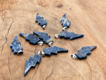 Sodalite lightning crystal pendant from GemstoneGO featuring a deep blue and white lightning stone pendant on a silver chain.