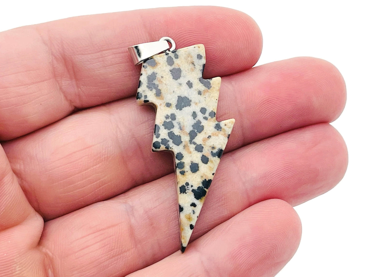 Dalmatian Jasper Lightning Crystal Pendant by GemstoneGO featuring a striking lightning-shaped jasper stone necklace.