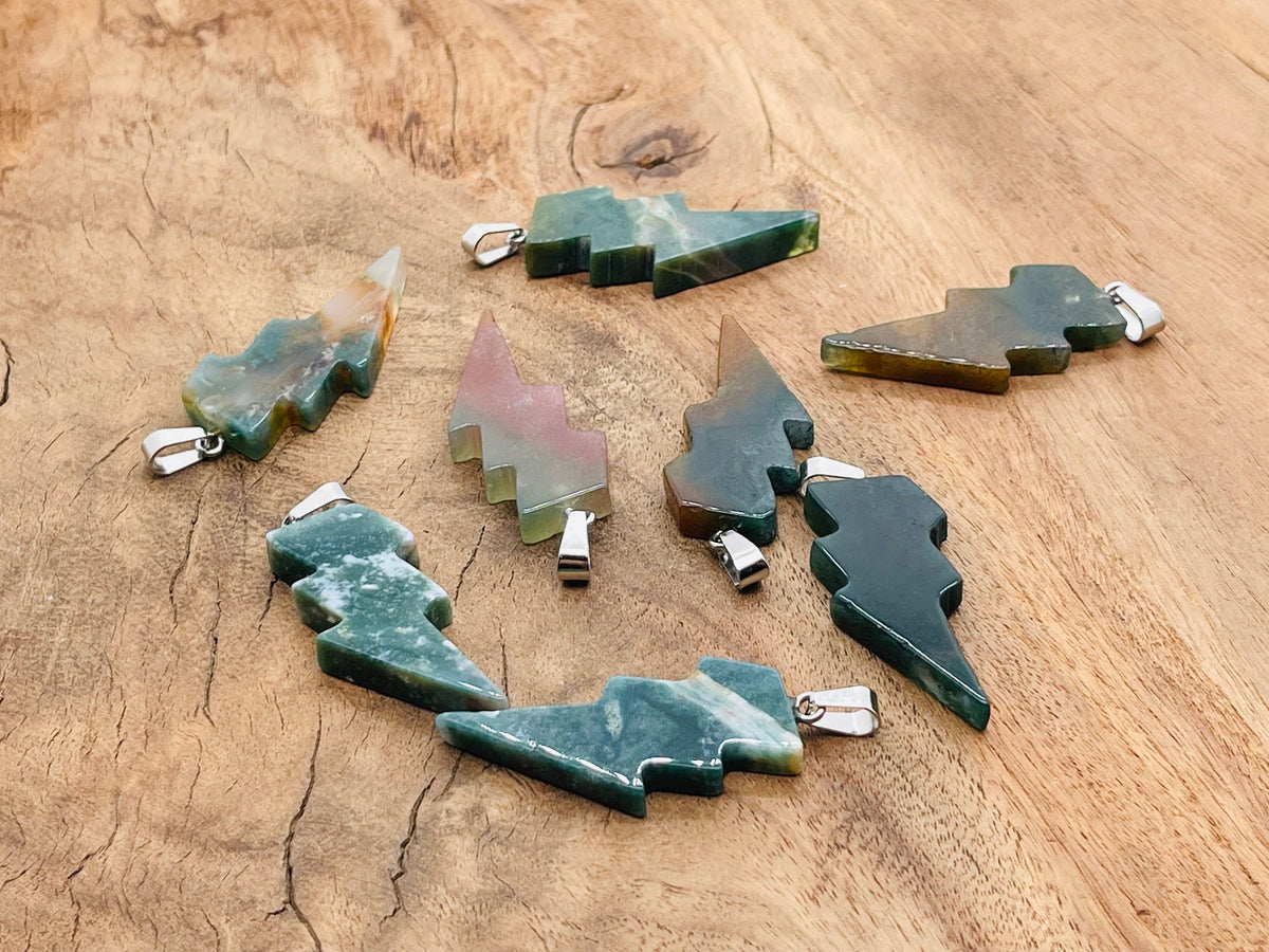 Moss agate lightning crystal pendant from GemstoneGO showcasing a natural lightning stone gemstone on a silver chain.