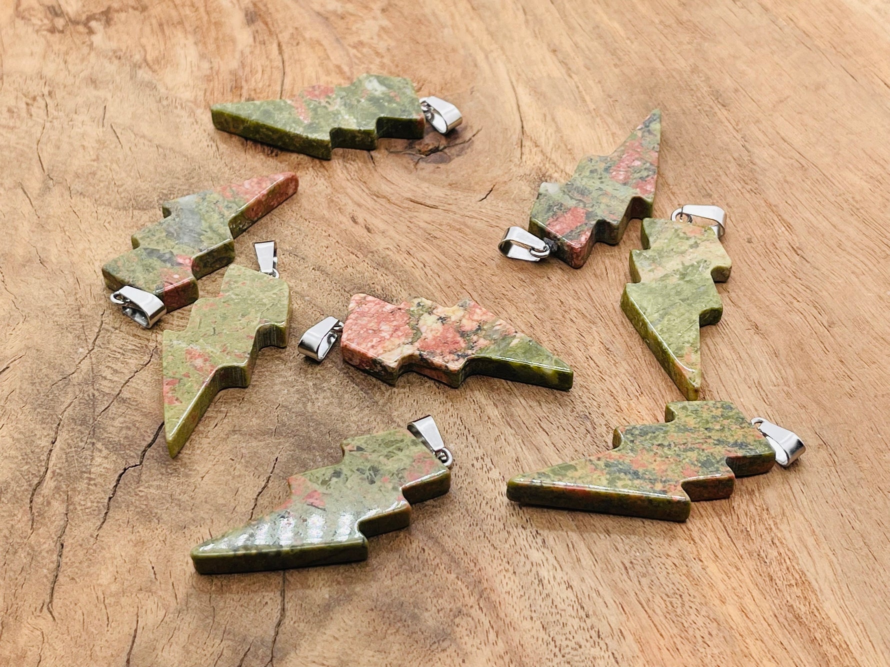 Unakite lightning crystal pendant from GemstoneGO, featuring a vibrant lightning stone gemstone on a silver chain.
