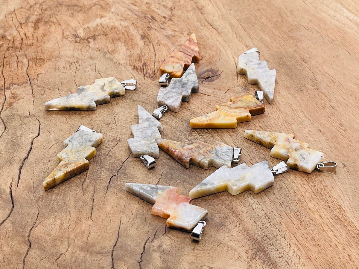 Crazy Lace Agate Lightning Crystal pendant from GemstoneGO featuring a vibrant lightning stone with intricate patterns and natural crystal details.