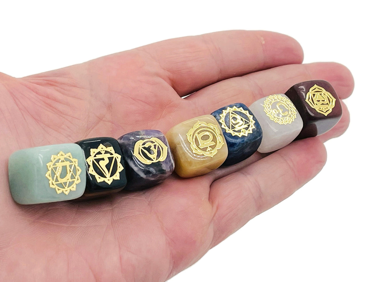 Natural 7 Chakra stones set from GemstoneGO featuring polished crystals arranged for meditation and energy balancing.