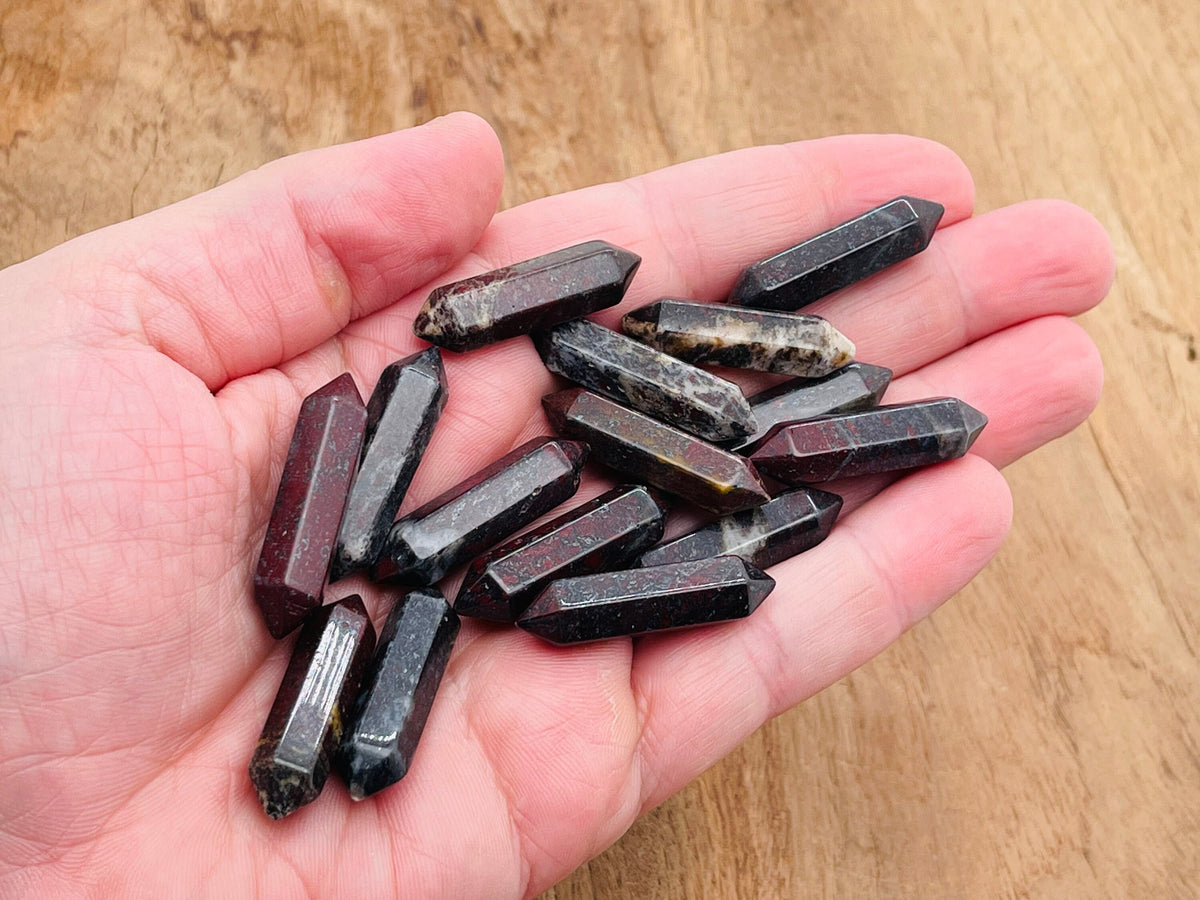 Dragon Blood Jasper carved terminated gemstone point, 33mm, from GemstoneGO, showcasing rich red and black natural mineral patterns.