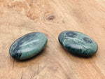 Kambaba Jasper palm gemstone spa stone, 60x40mm, smooth rounded stone with green and black patterns, from GemstoneGO.