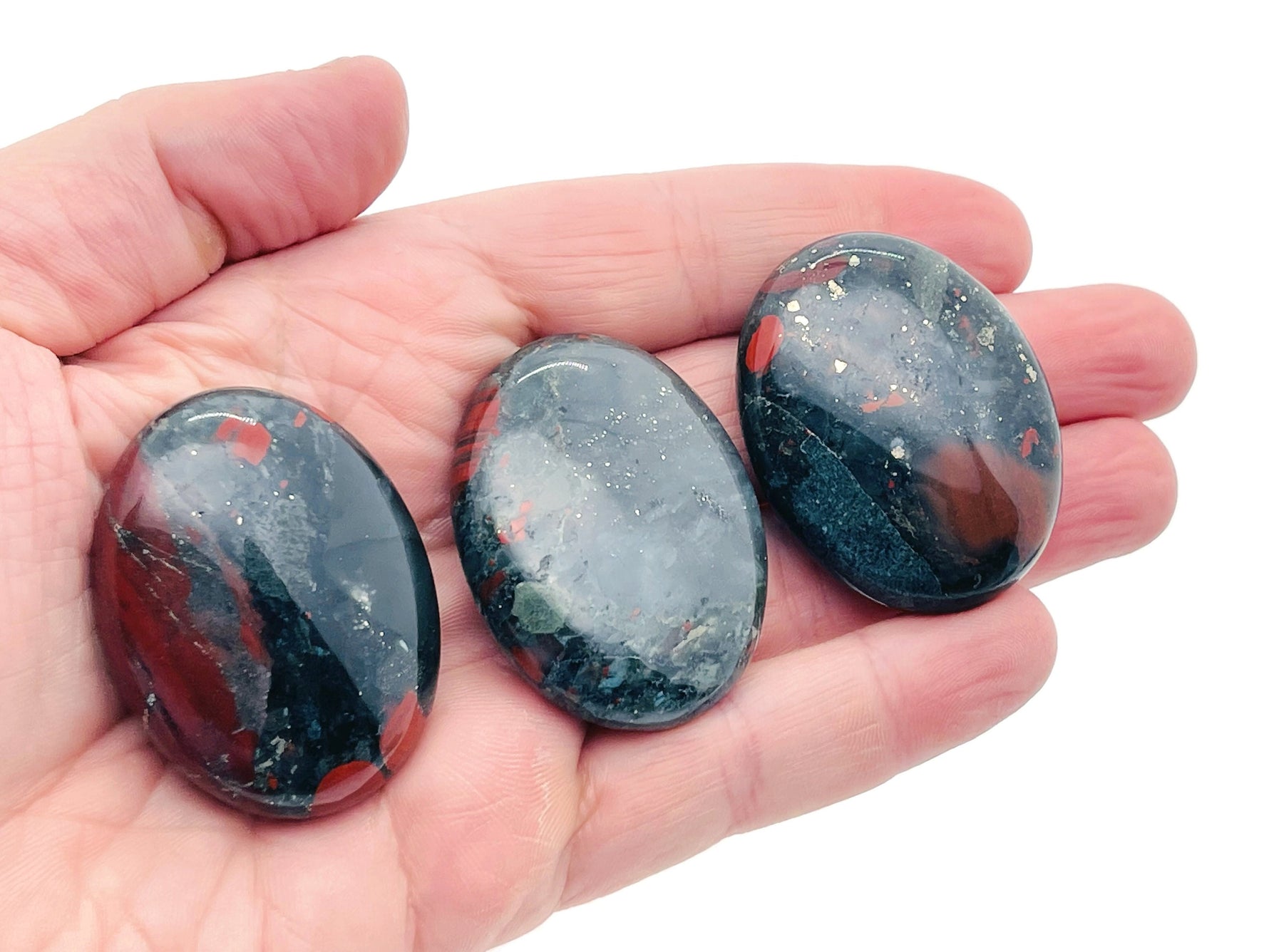 African Bloodstone palm gemstone spa stone, 45x35mm, polished natural healing stone from GemstoneGO, smooth and vibrant red-green mineral.