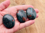 African Bloodstone palm gemstone spa stone, 45x35mm, smooth polished healing crystal for massage and relaxation therapy.