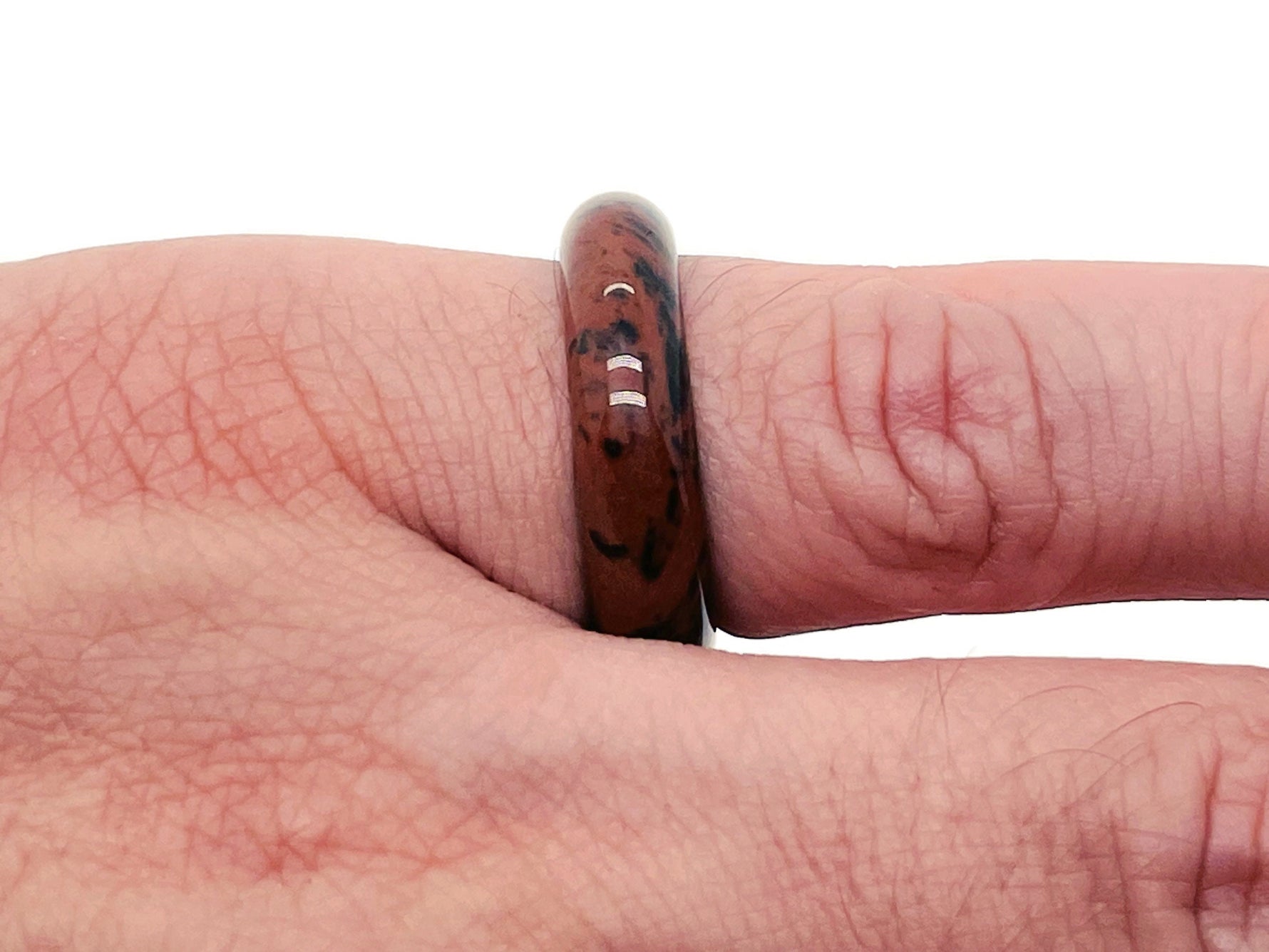 Mahogany Obsidian crystal ring from GemstoneGO featuring a polished gemstone set in a silver band.