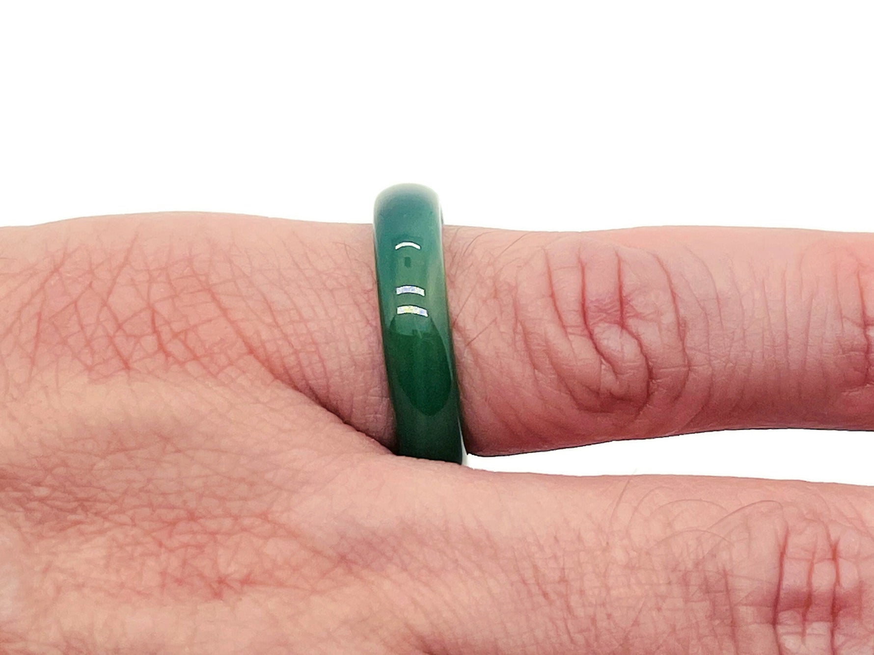 Green Agate crystal ring by GemstoneGO featuring a polished green agate stone set in a silver band.