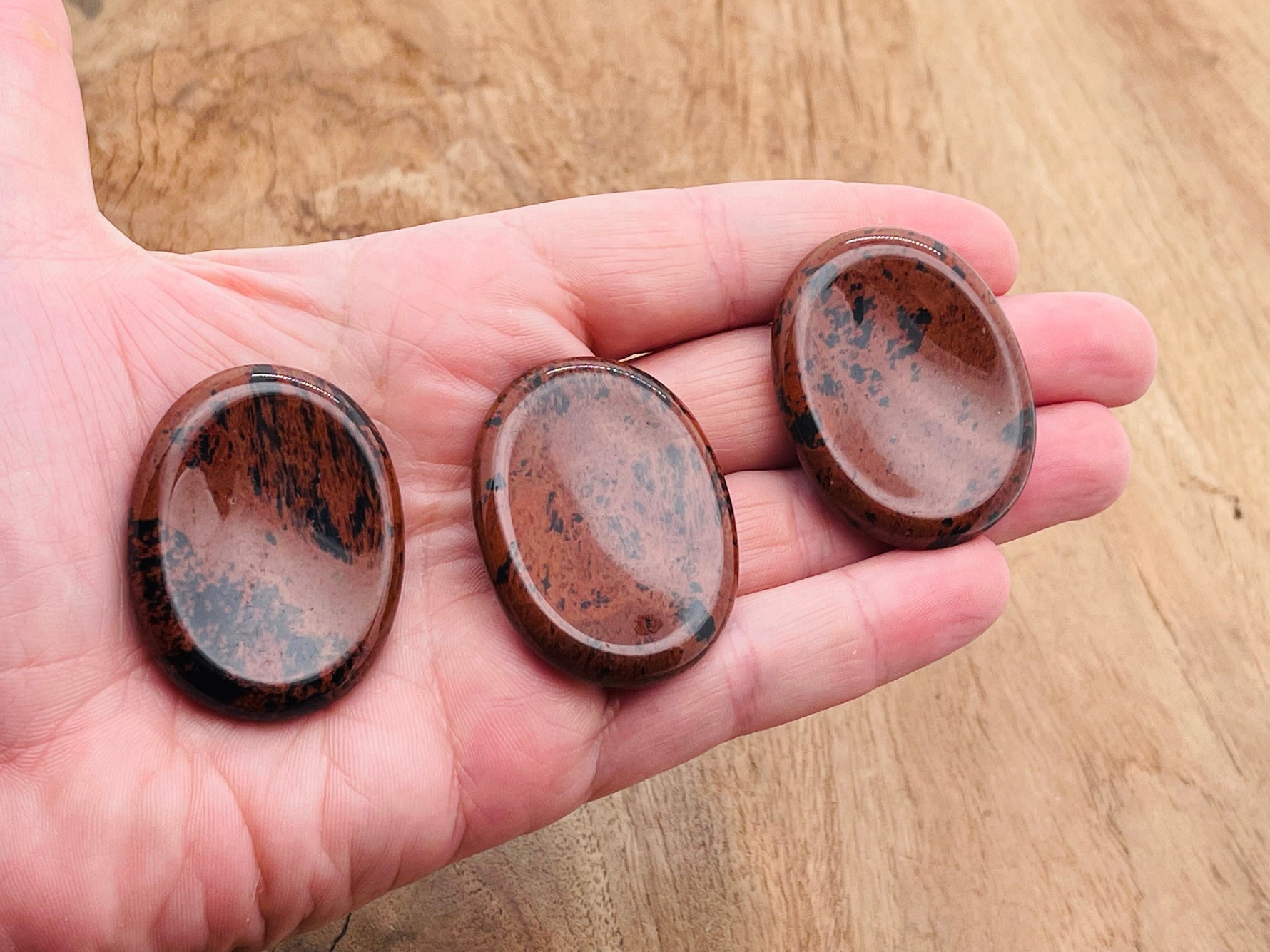Mahogany Obsidian worry stone from GemstoneGO, 4.5x3.5cm, smooth polished crystal for stress relief and meditation.