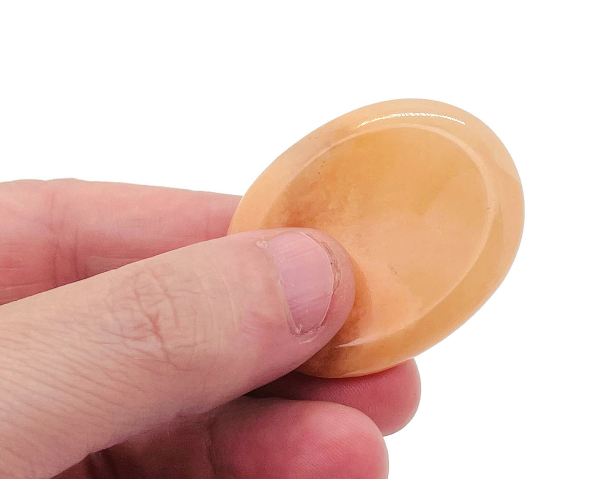 Orange aventurine worry stone from GemstoneGO, 4.5x3.5cm soothing crystal for stress relief and meditation.