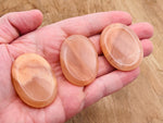 Orange aventurine worry stone from GemstoneGO, 4.5x3.5cm, smooth polished crystal for stress relief and calming.