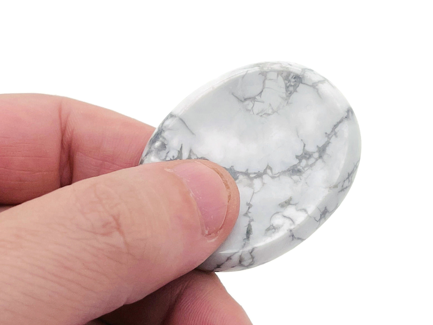 Howlite worry stone from GemstoneGO, 4.5x3.5cm soothing crystal for stress relief and meditation.