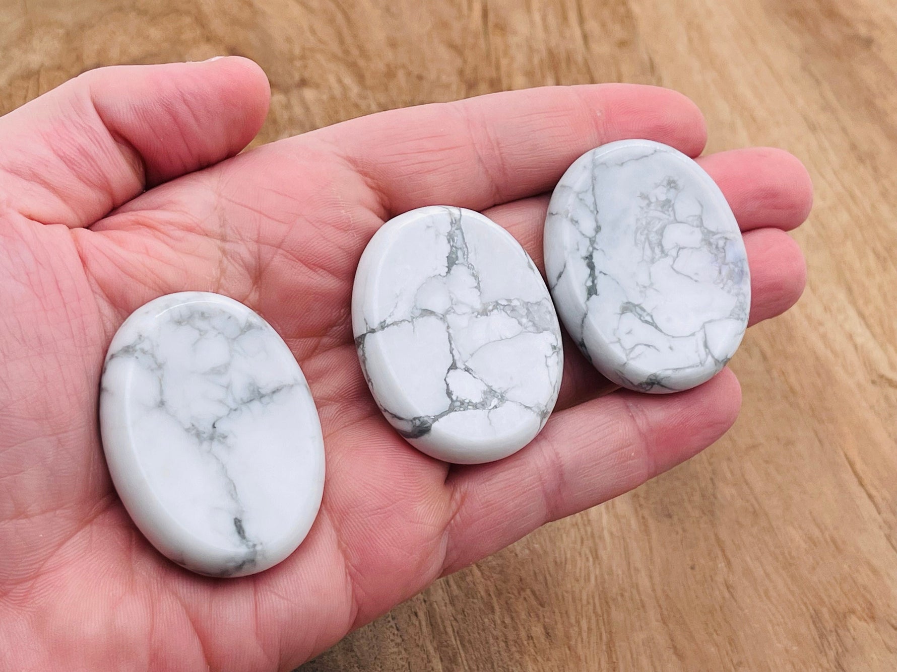 Smooth Howlite worry stone from GemstoneGO, measuring 4.5x3.5cm, featuring calming, polished crystal for stress relief and meditation.