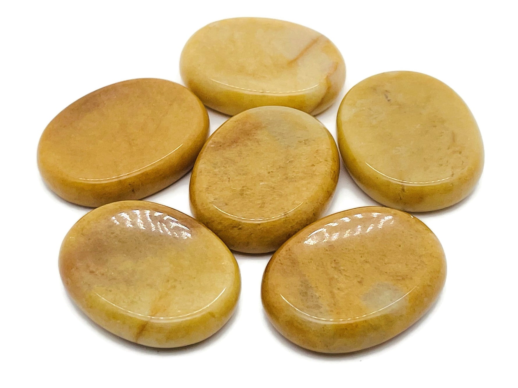 Yellow Jade worry stone from GemstoneGO, soothing crystal with smooth surface, measuring 4.5x3.5cm, ideal for stress relief and meditation.