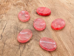 Cherry quartz worry stone from GemstoneGO, 4.5x3.5cm soothing crystal for stress relief and mindfulness.