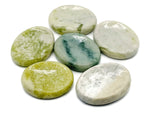 Smooth green jade worry stone with rounded edges, measuring 4.5x3.5cm, from GemstoneGO, used for calming and stress relief.