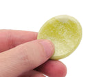 Smooth jade worry stone from GemstoneGO, measuring 4.5x3.5cm, featuring a polished, soothing crystal surface for stress relief.