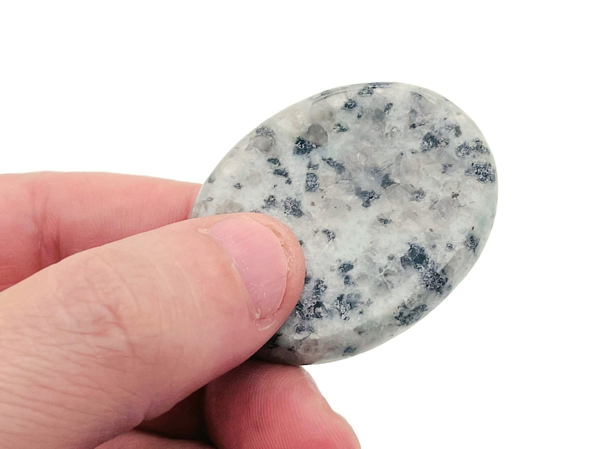 Kiwi Jasper worry stone from GemstoneGO, soothing crystal with green and brown patterns, measuring 4.5x3.5cm.