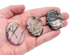 Rhodonite worry stone from GemstoneGO, 4.5x3.5cm soothing crystal for stress relief and meditation.