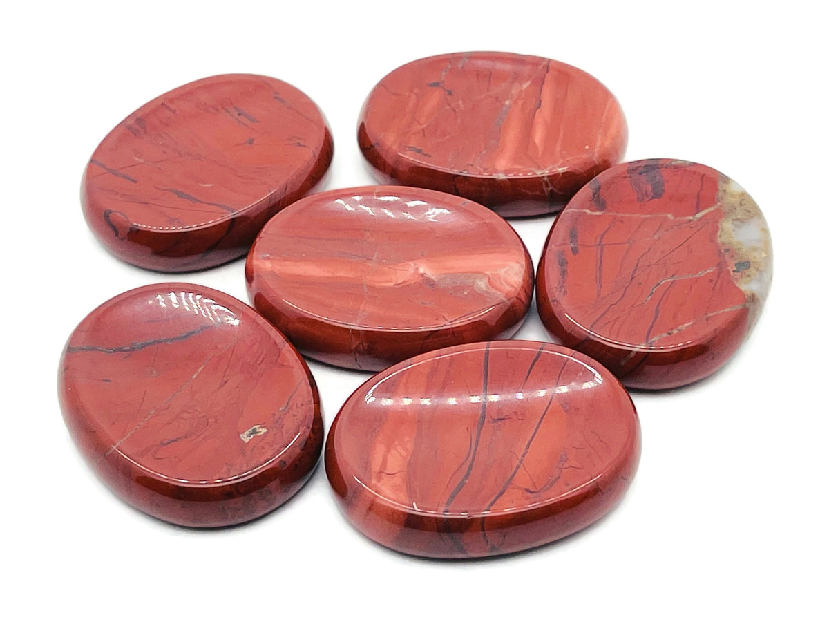 Red Jasper worry stone from GemstoneGO, 4.5x3.5cm smooth crystal for stress relief and calming, with polished red stone surface.