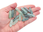 Green fluorite terminated carved point gemstone, 33mm, with vibrant green hues and natural crystal formations, from GemstoneGO.