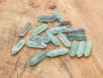 Green fluorite terminated carved point gemstone, 33mm, showcasing vibrant color and natural crystal formation by GemstoneGO.