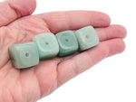 Handmade aventurine crystal incense holder with carved design, featuring a stone surface and a slot for incense sticks.