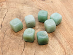 Handmade aventurine crystal incense holder with carved design, perfect for holding incense sticks and showcasing natural stone beauty.