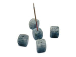 Handmade Labradorite crystal incense holder with carved design, featuring a natural stone surface for incense sticks.