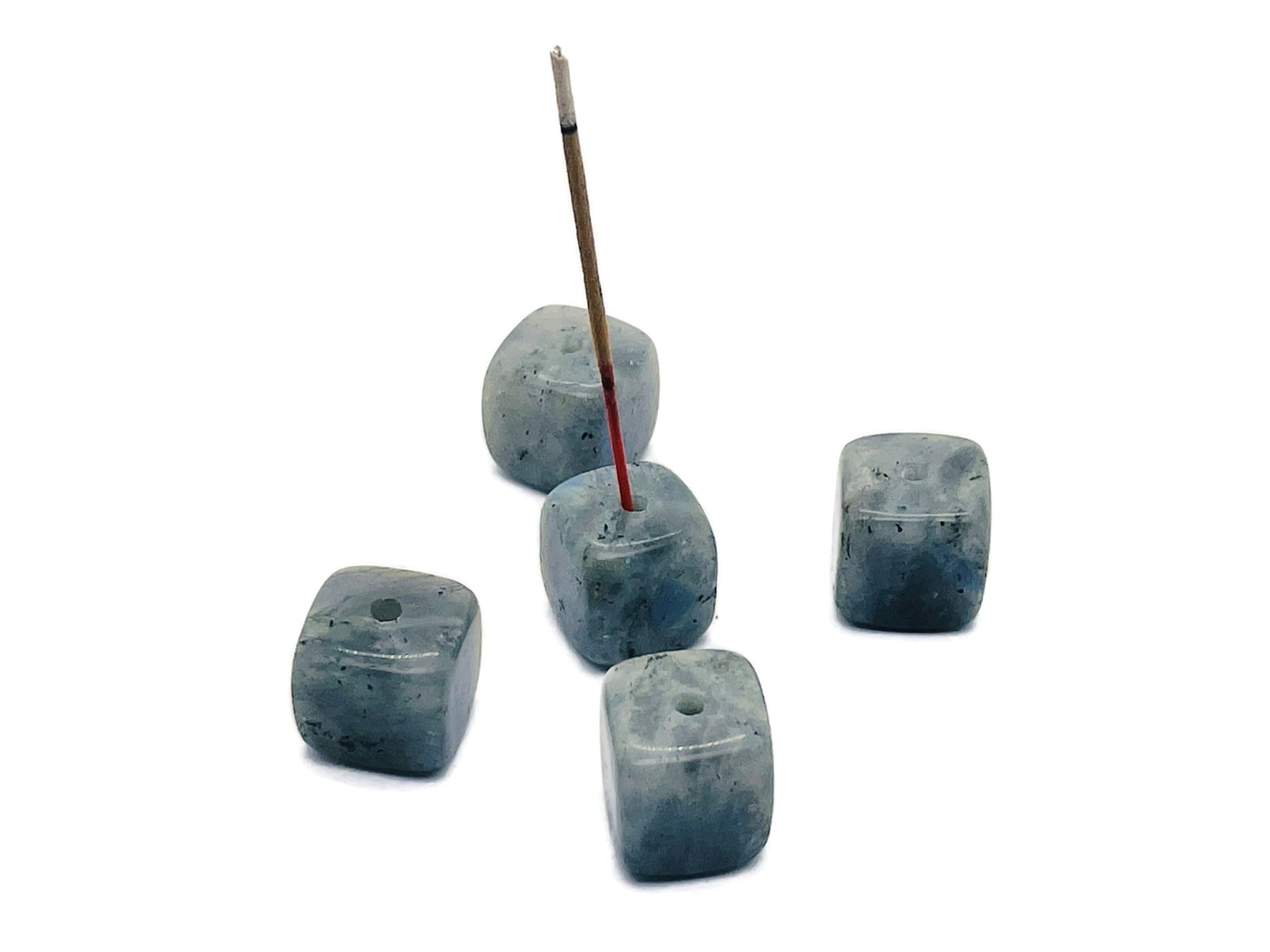 Handmade Labradorite crystal incense holder with carved design, featuring a natural stone surface for incense sticks.