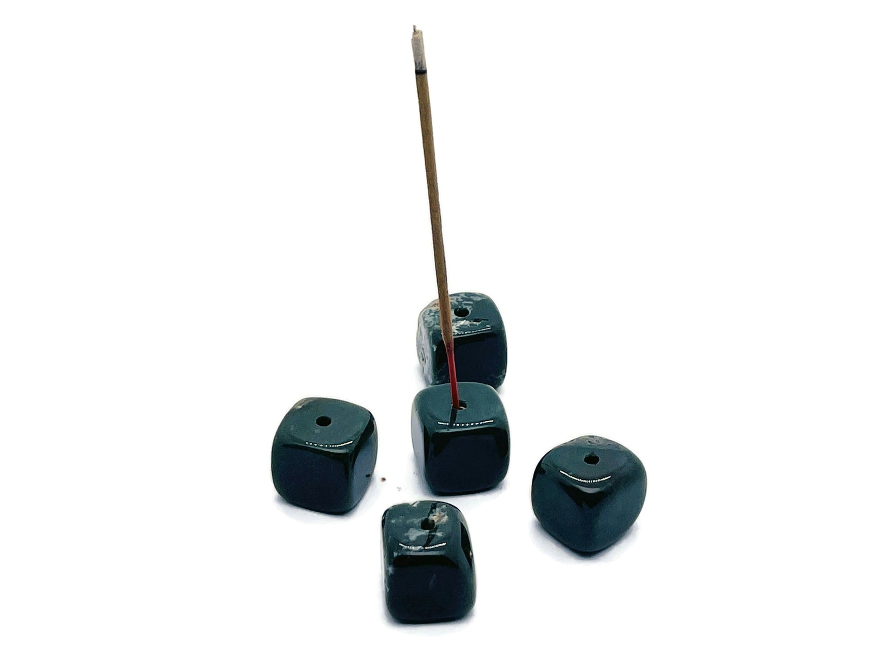 Handmade moss agate crystal incense holder with carved design, featuring a natural stone surface for holding incense sticks.