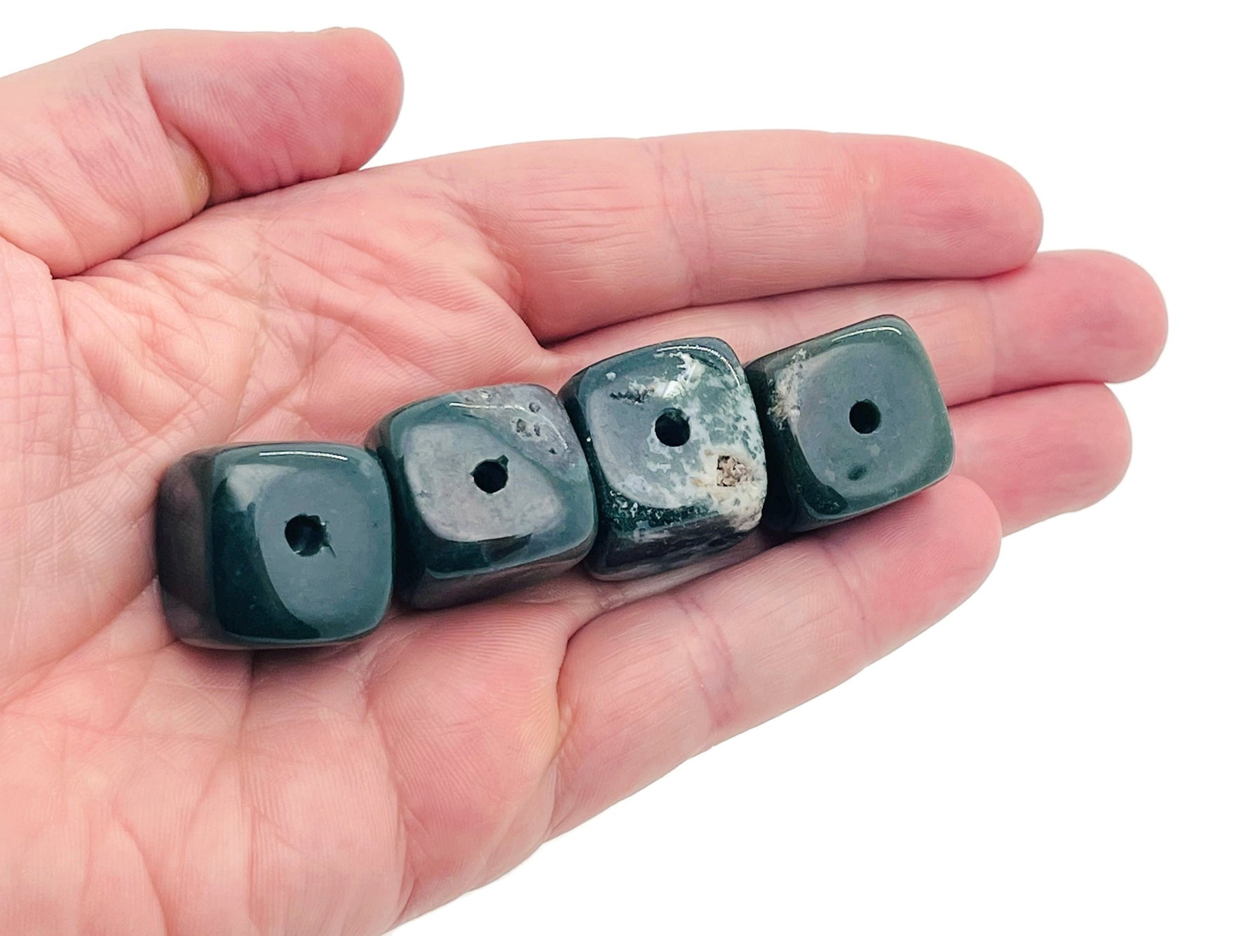 Handmade moss agate crystal incense holder with carved design, featuring a natural stone surface for incense sticks.