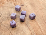 Handmade Lepidolite crystal incense holder with carved design, showcasing a natural stone with purple and pink hues for incense sticks.